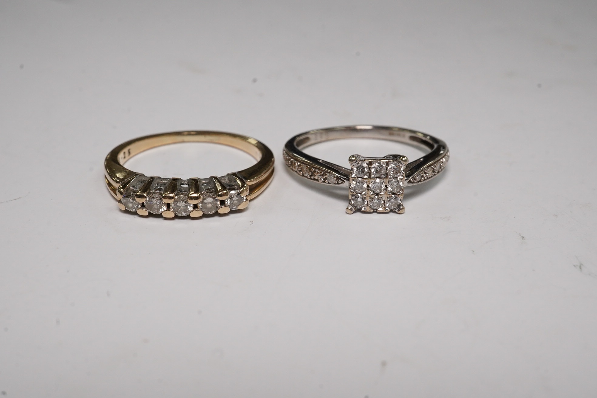 Two modern 9ct gold and diamond set rings, including square cluster and five stone half hoop, gross weight 4.2 grams.